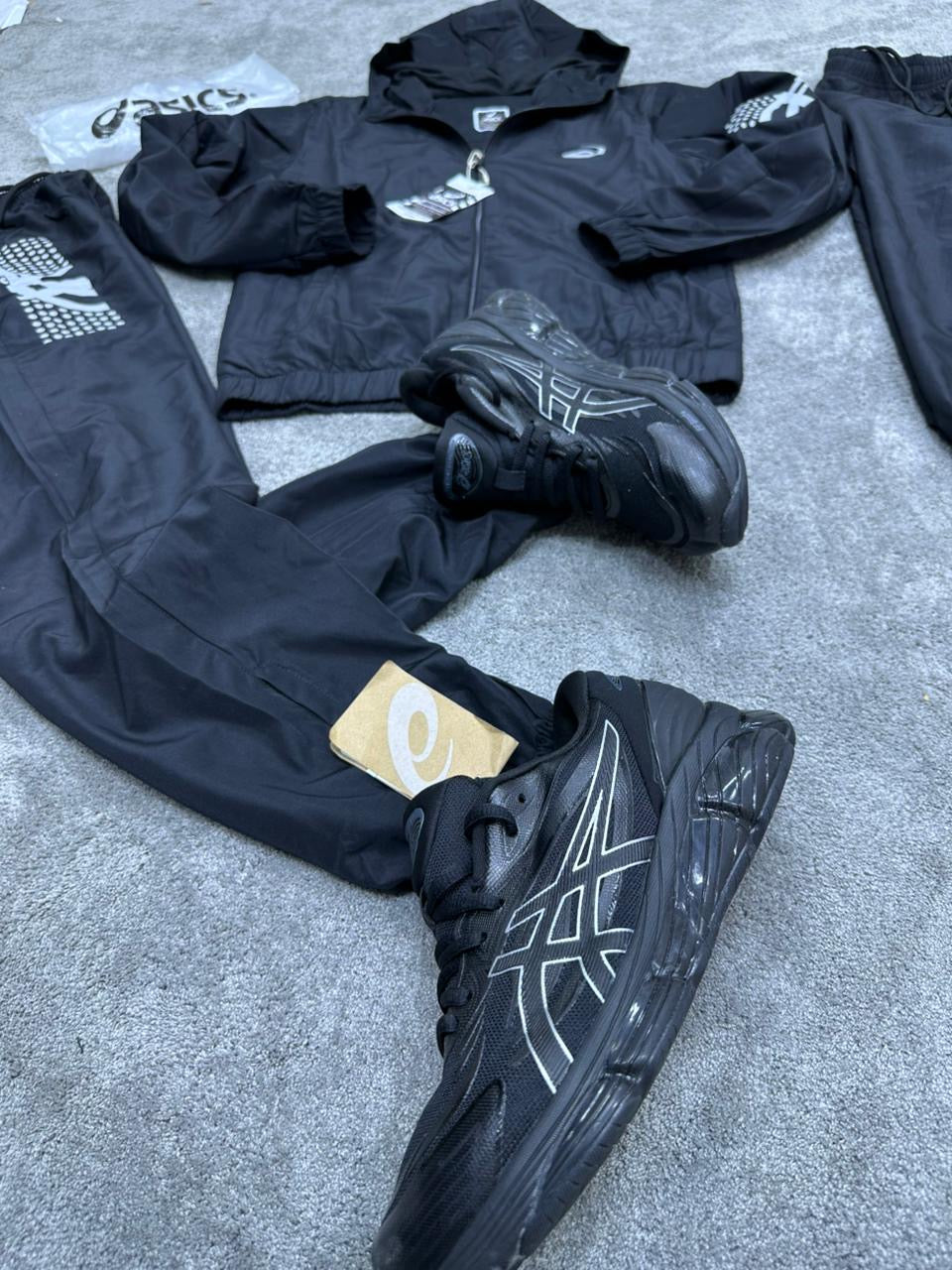 Chandal Asics *reflectante* negro